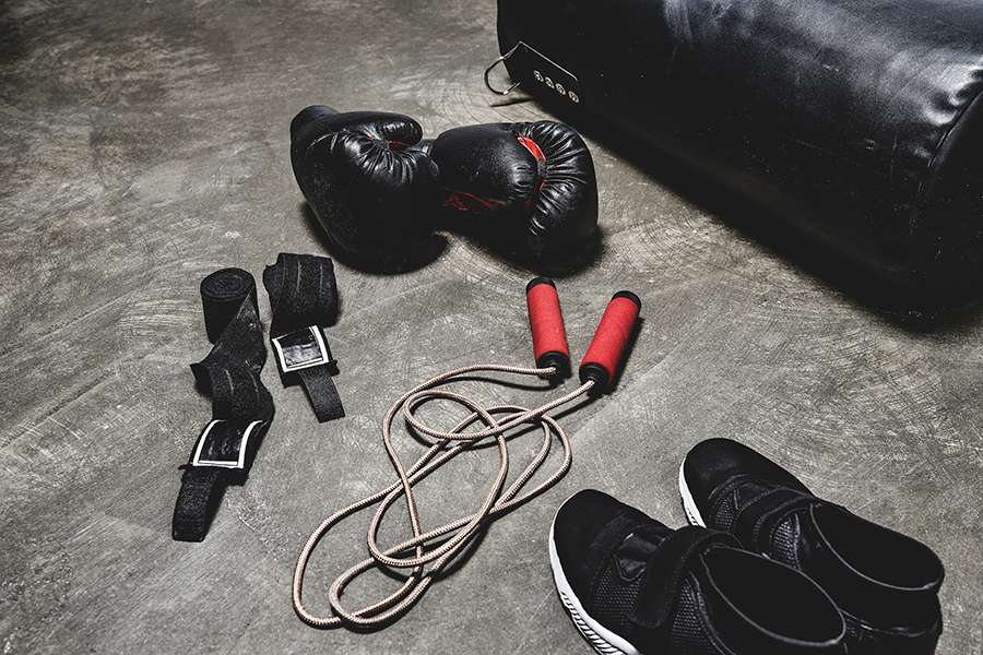 Boxing equipment displayed on cement floor